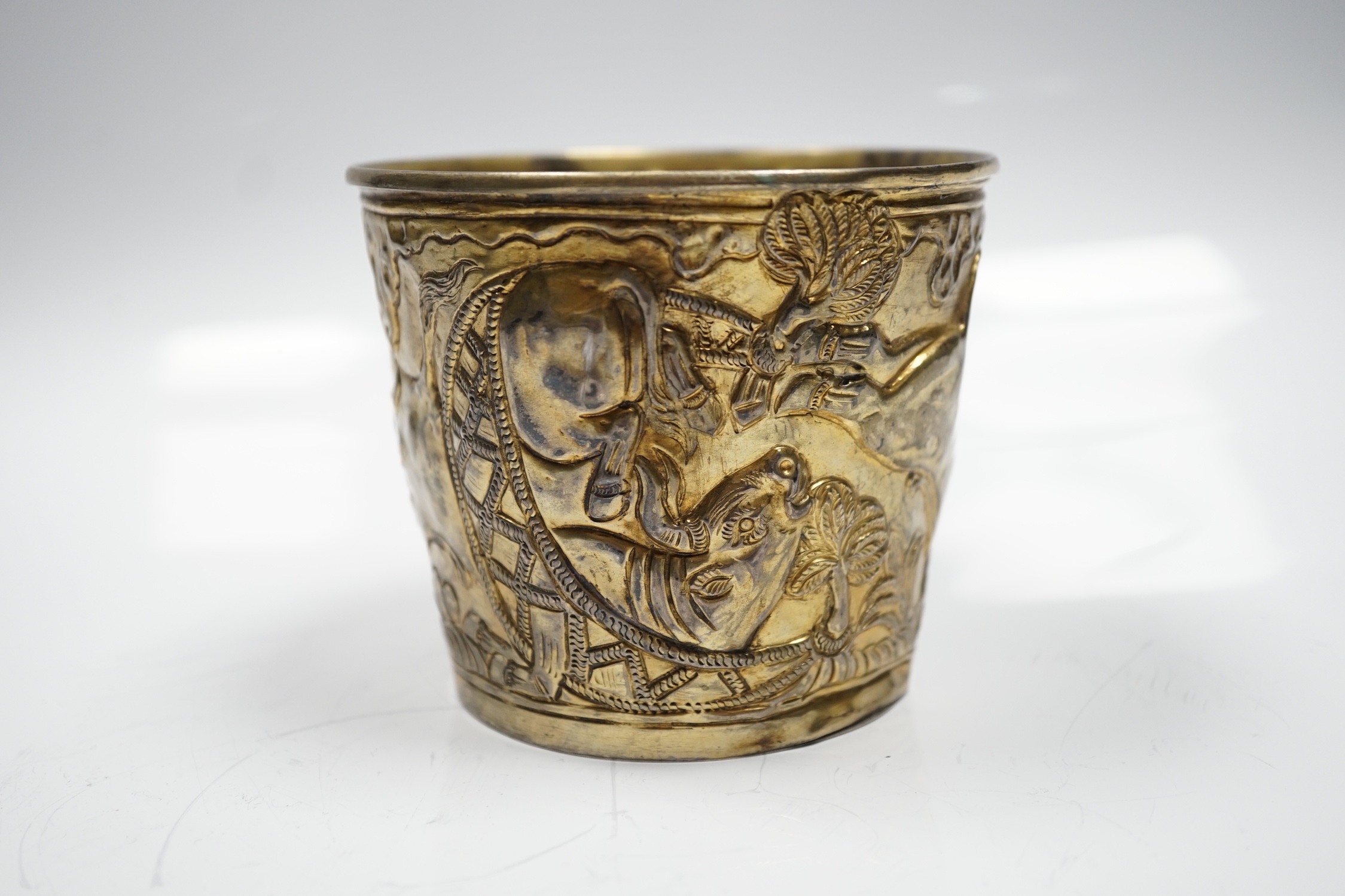 A Greek Lalaounis 900 standard gilt white metal, cup, embossed with continuous raging bull scene, height 90mm, 6.5oz.